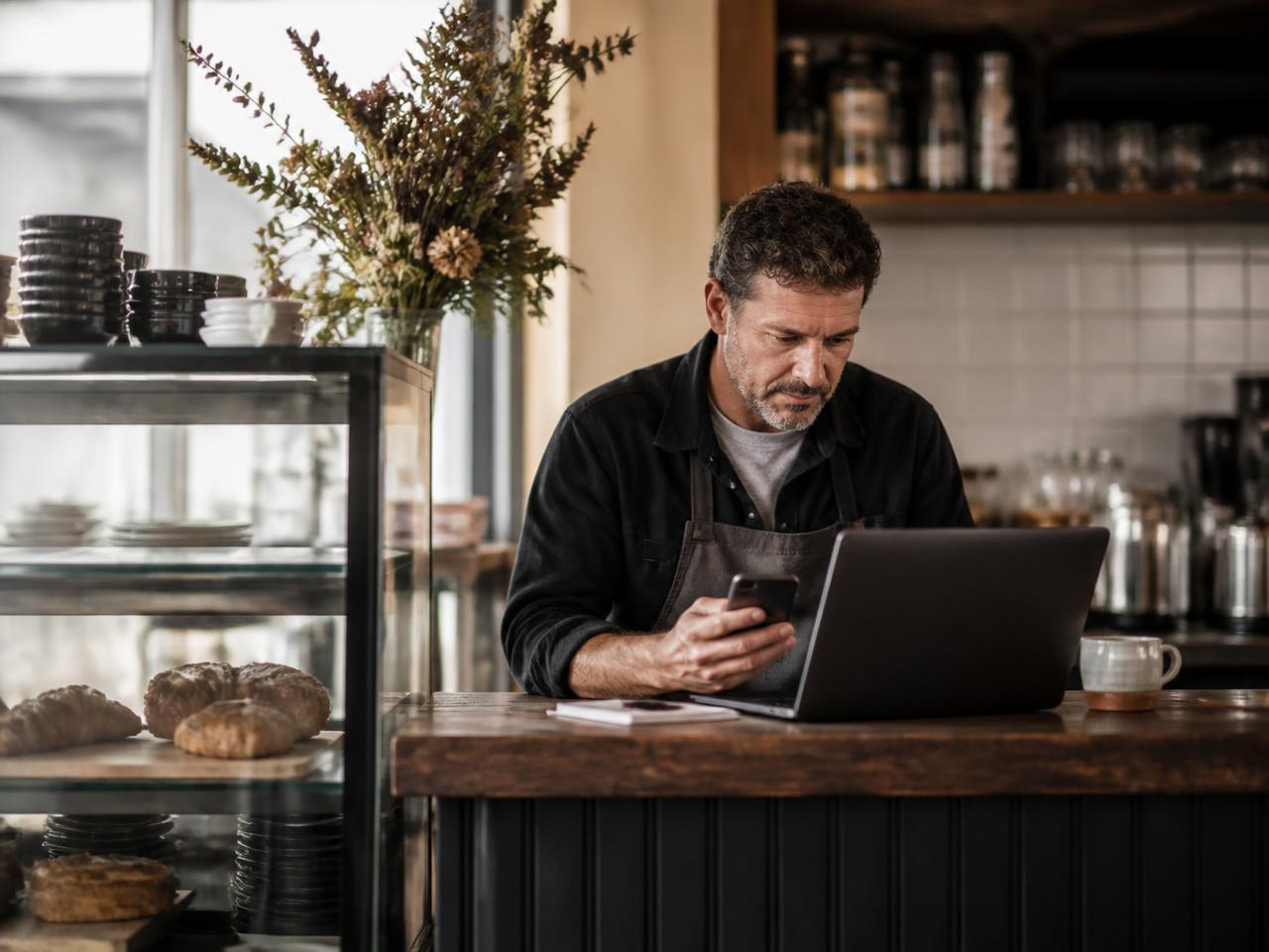 Independent café owner managing customer messages